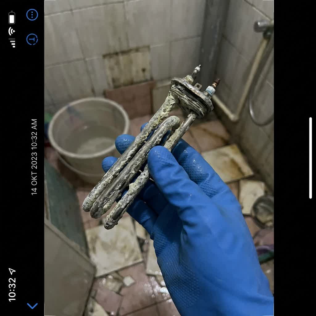 Corroded water heater element with heavy limescale buildup